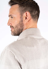 Nilson strik med struktur og zip i lys sand