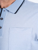 Hester polo med brystlomme I lys blå